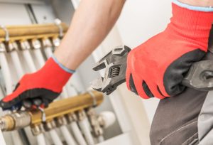 Plumber diagnosing a plumbing problem